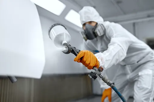 Spray finishing cabinet doors in our Torrance spray area